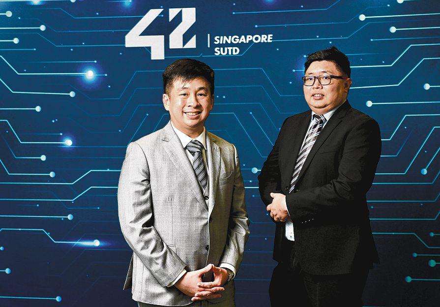 Two men achieve rare milestones at SUTD's coding school