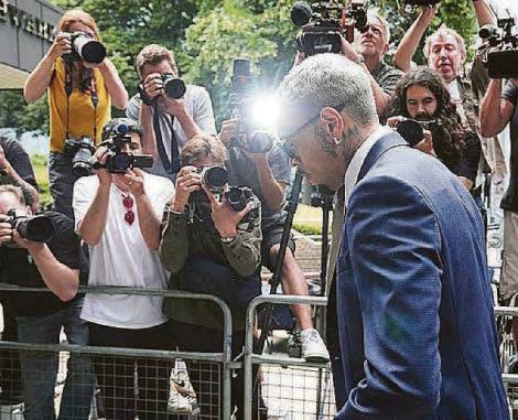 Singer's not guilty plea over 'bottle attack'