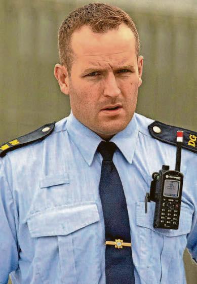 Garda charged with assault & burglary
