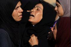 Israeli fire kills 30 in Gaza, medics say, as attention shifts to Iran
