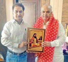 On Ashok Koul's birthday, Balbir presents portrait of Guru Ravidas to him