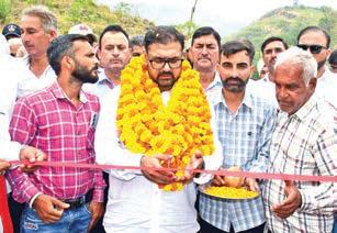 Satish inaugurates key road projects, distributes relief kits, felicitates meritorious students in Akhnoor
