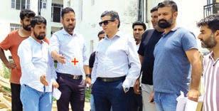 Dr Karwani inspects work on transit accommodations for PM Package Employees