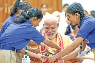Modi celebrates Raksha Bandhan with students, others