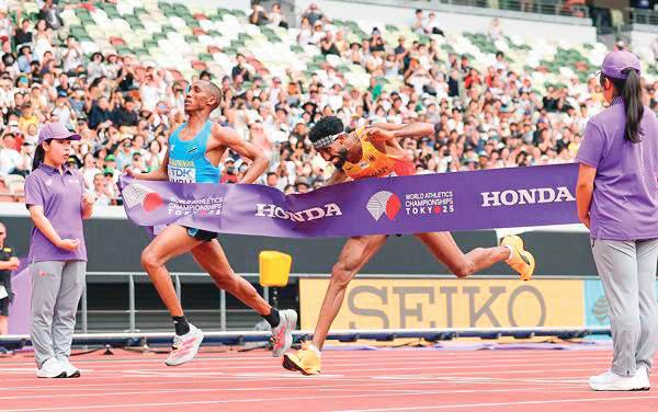 Simbu takes world marathon title in photo-finish