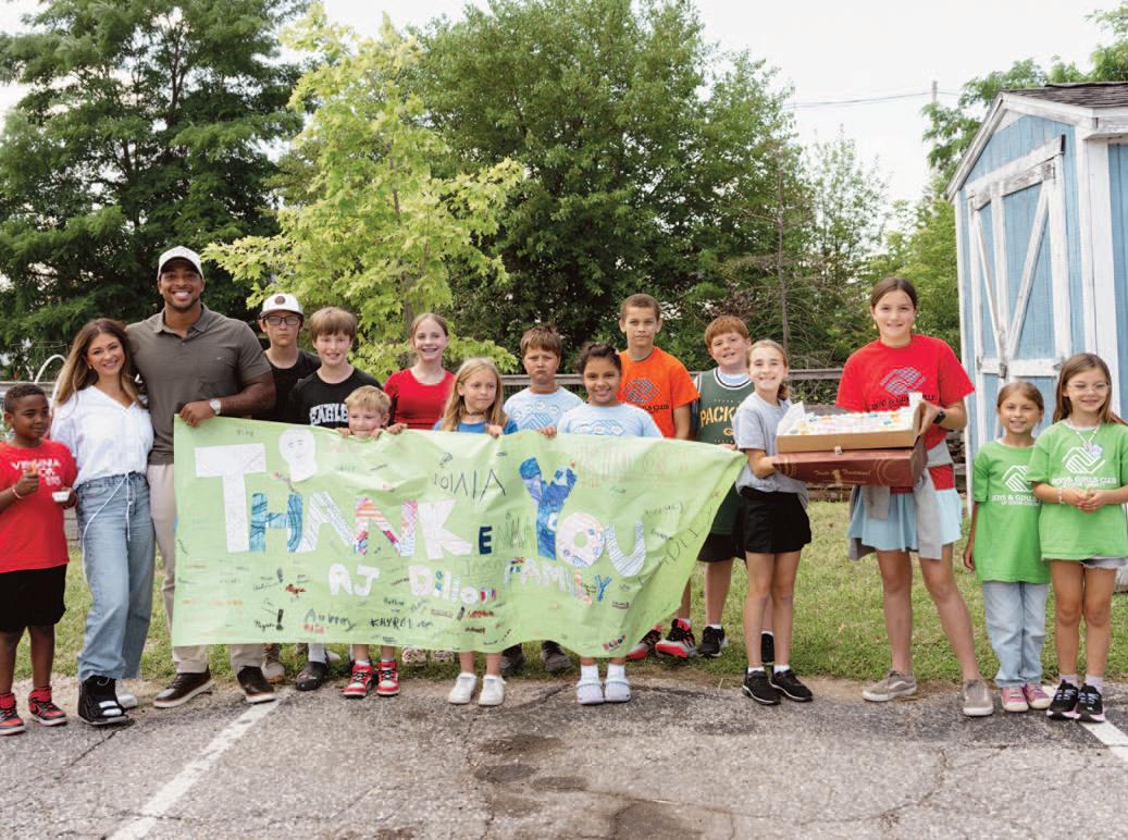 NFL Running Back AJ Dillon celebrates one-year anniversary of Dillon Family Foundation with donation to Boys & Girls Club of Door County