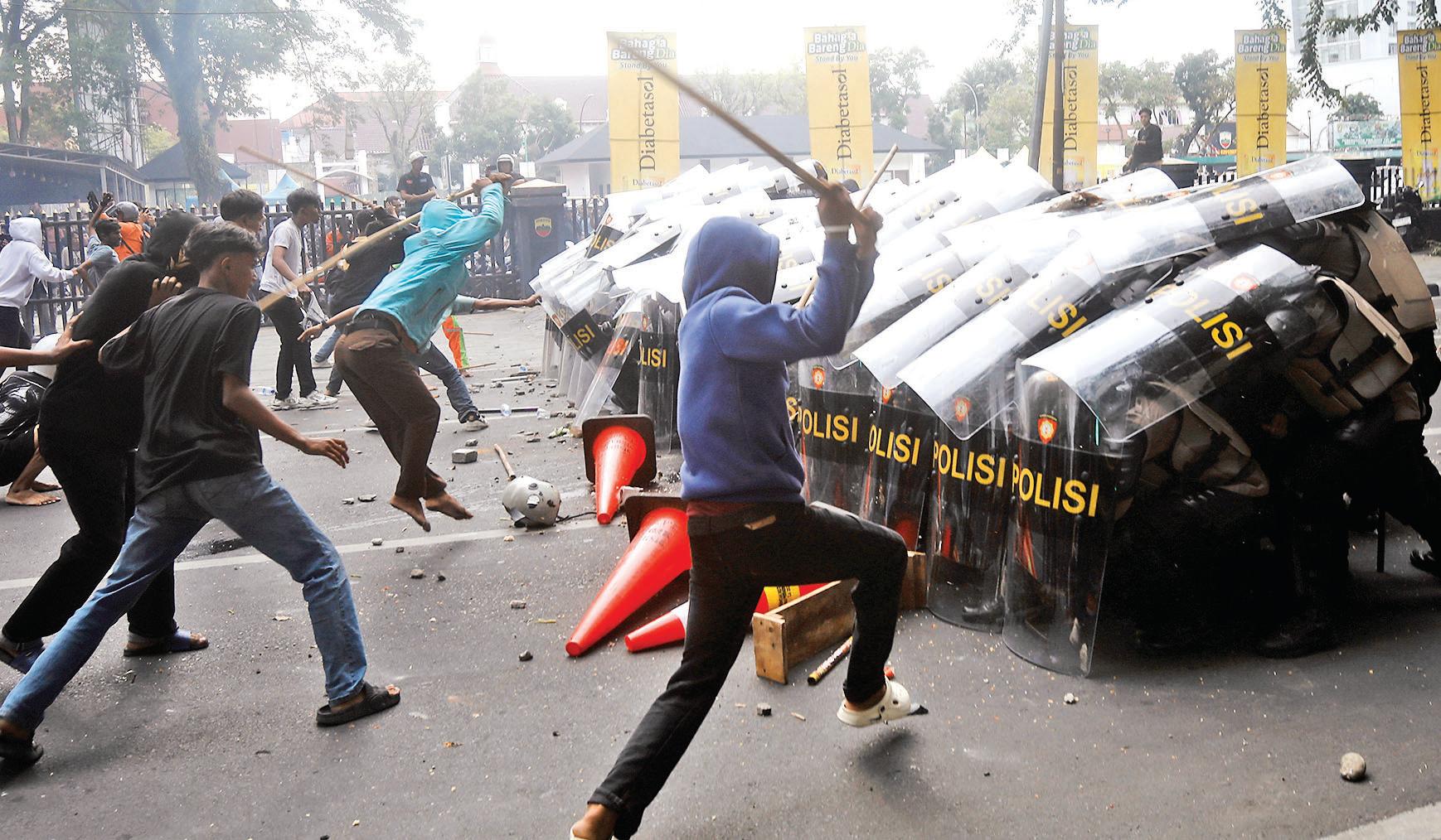 Tensions Grips Jakarta After Policemen Fatally Strike Rider
