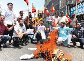 BJYM stages protest against Urdu requirement in NT posts