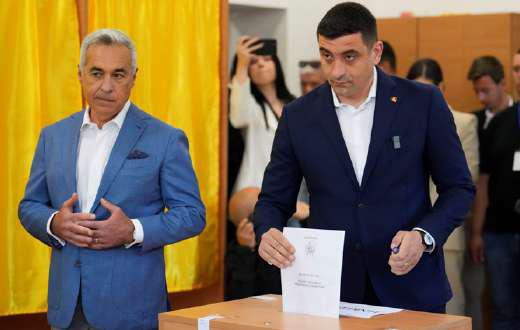 Romania's Far-right Simion faces pro-EU Dan