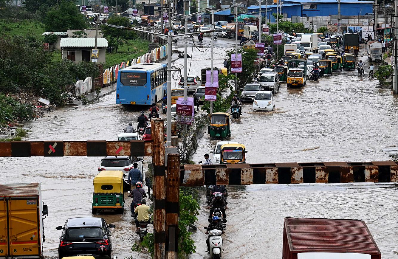 RAIN POUNDS, CITY DROWNS