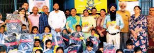 50 school bags distributed to students by Hardeep Kaur Lalpura at Committee School