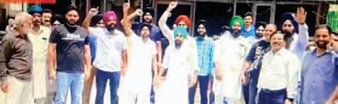 Residents of village Chhajjumajra raise slogans outside Municipal Council office regarding their demands
