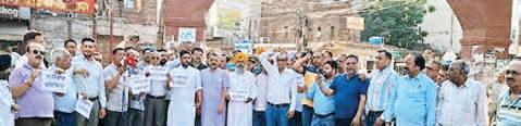 Residents of GBP colony protest outside MC office against illegal occupation of centuries-old rainwater drain by builder