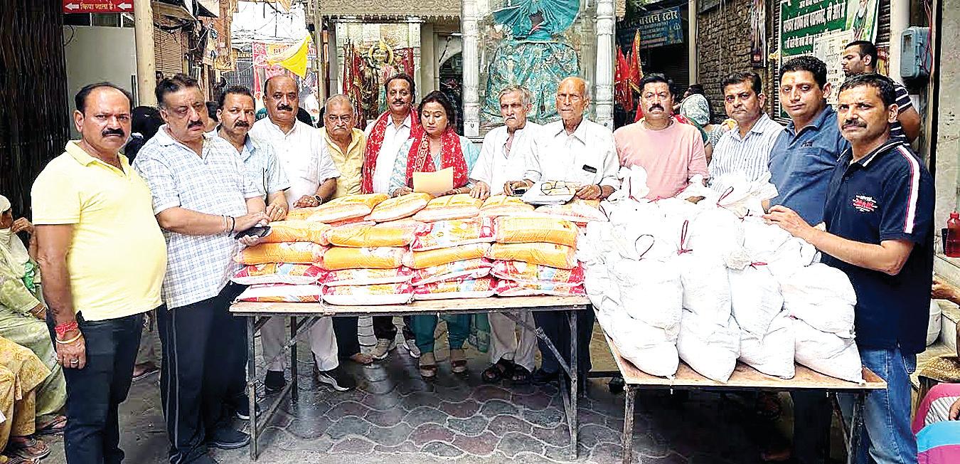 Monthly ration distribution ceremony by Ashapurni Samaj Sudhar Sabha