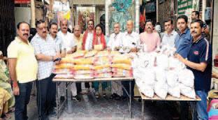 Monthly ration distribution ceremony by Ashapurni Samaj Sudhar Sabha
