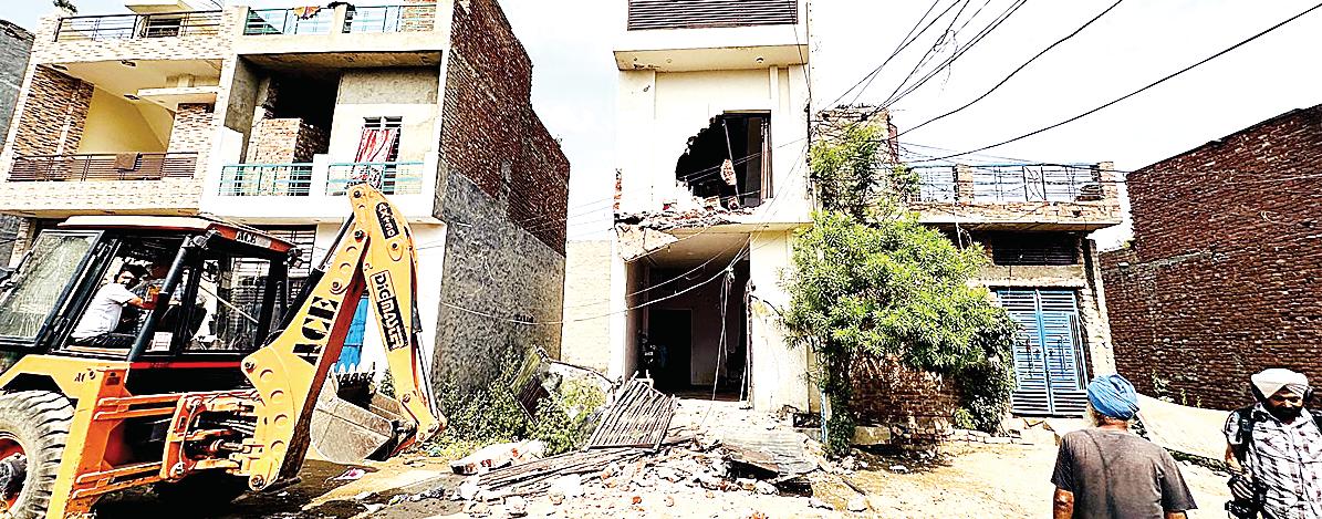 Govt strikes hard in drug war: Illegal assets of drug smugglers bulldozed back to back