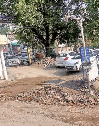 Deep pothole near Tauni Devi Civil Hospital entry gate hinders ambulance access, patients suffer