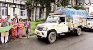 Guv flags off vehicles with relief material