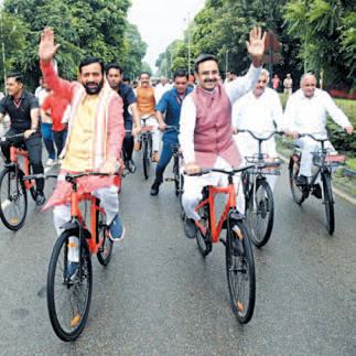 CM Saini cycles to house with Ministers, MLAs