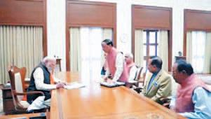 PM shifts to new office, signs welfare schemes for farmers, women, youth