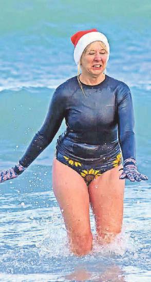 Brave swimmers take a chilly dip on Boxing Day