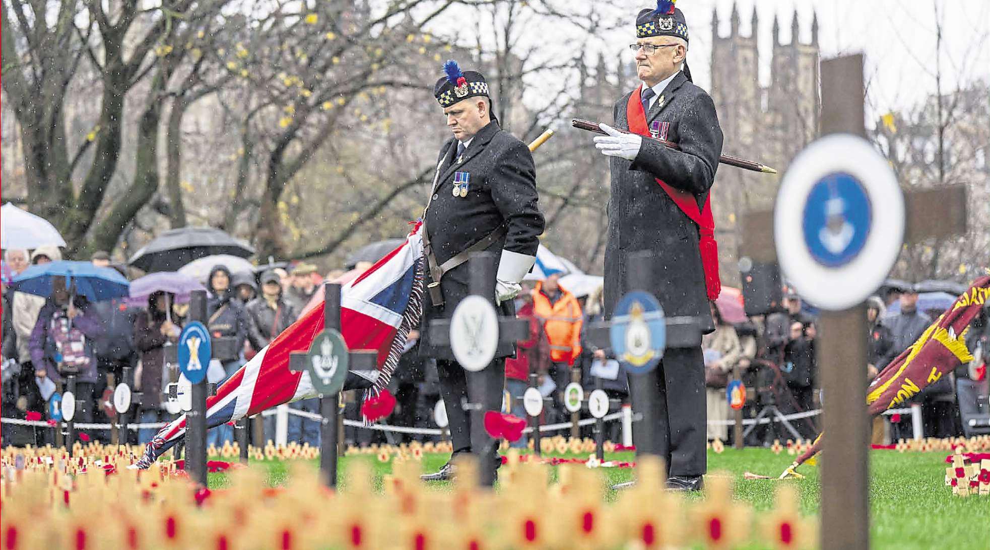 Hundreds gather in city to pay their respects on a rainy Armistice Day