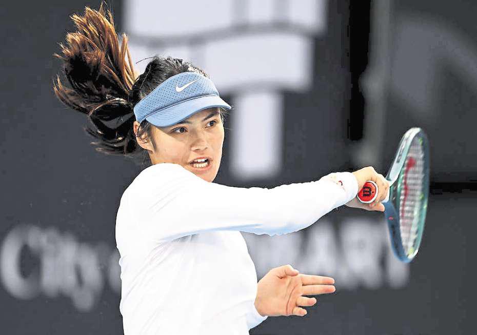 Raducanu recovers from poor start to reach second round