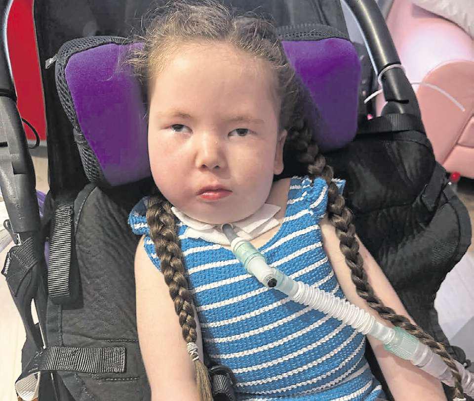 Sophia's smile says it all as she enjoys a dip in the pool