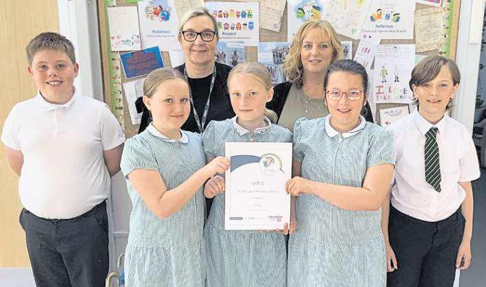 Pupils strike gold for outstanding behaviour