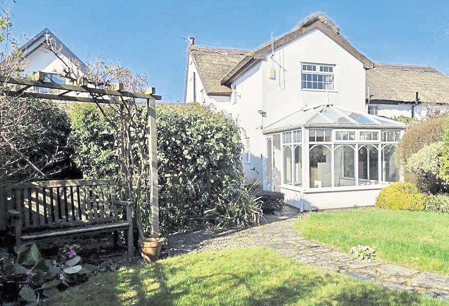 This charming cottage is perfect for the green-fingered buyer