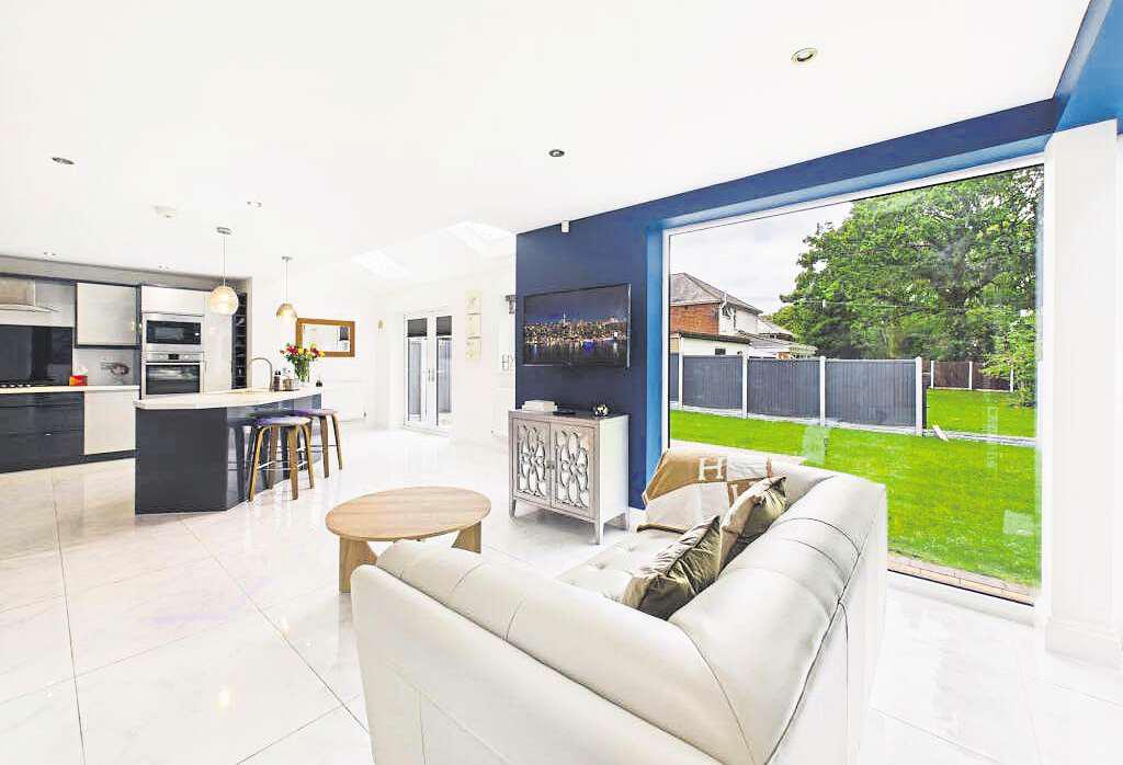 A stunning open-plan living space is at the heart of this home