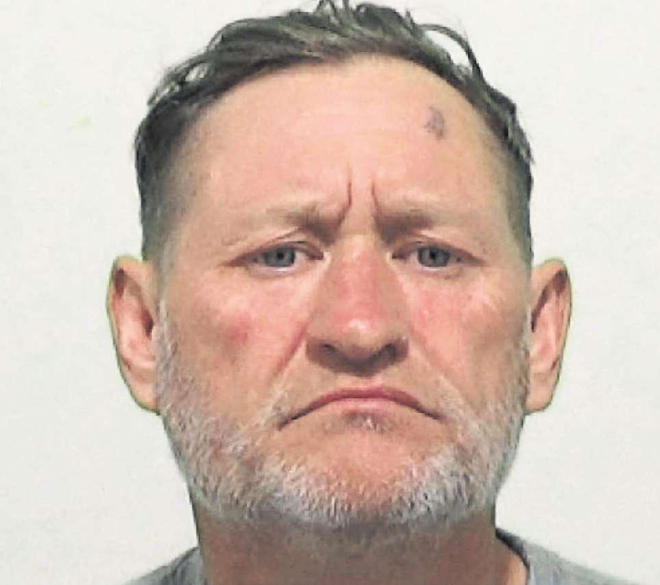 Thug attacked his pals and racially abused an officer