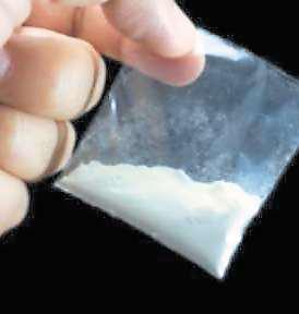 Driver who left bag of cocaine in back of police car banned for a year