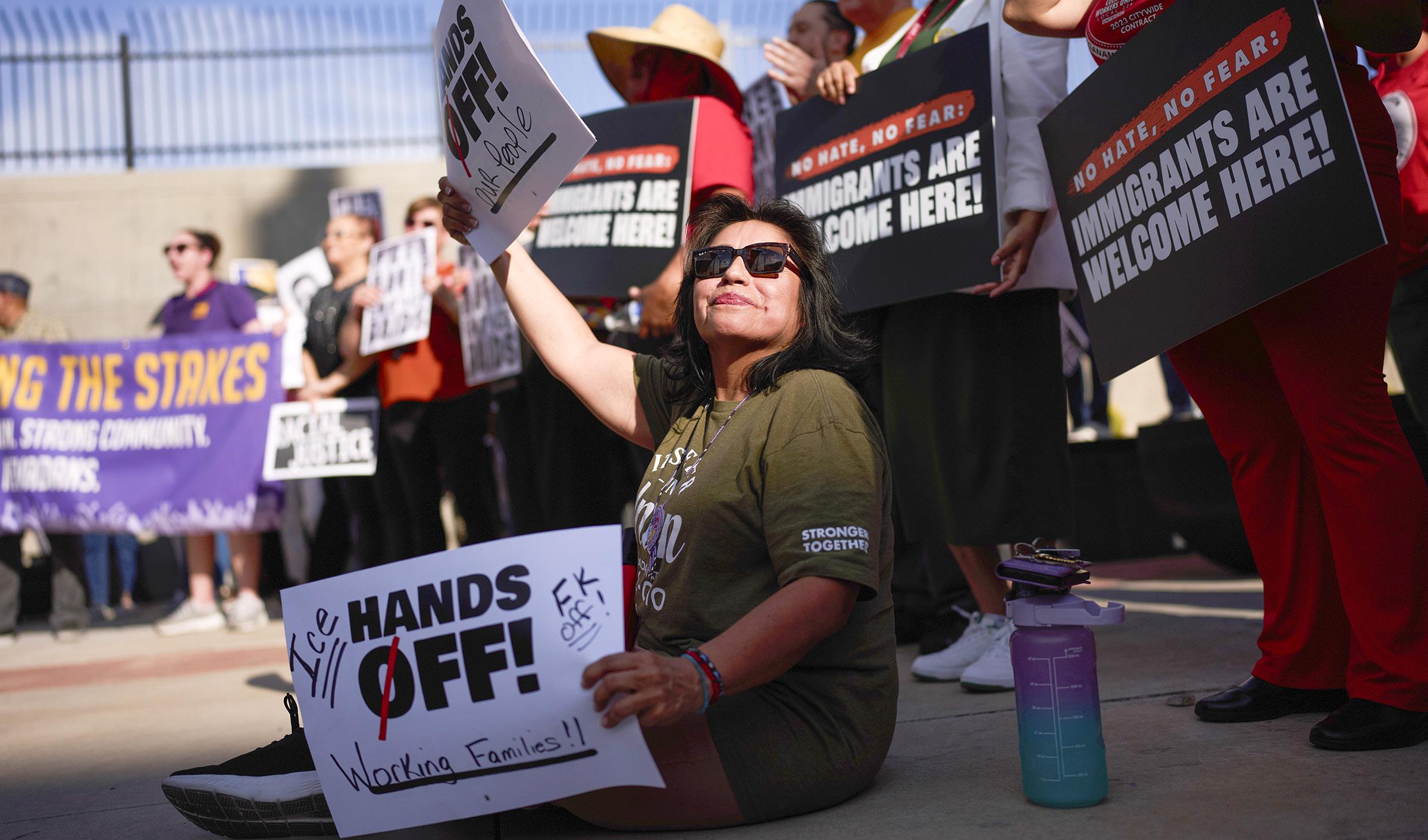 Protests over immigration raids pop up across the US, with more planned