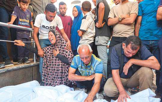 12 DEAD AS ISRAEL HITS SCHOOL-SHELTER