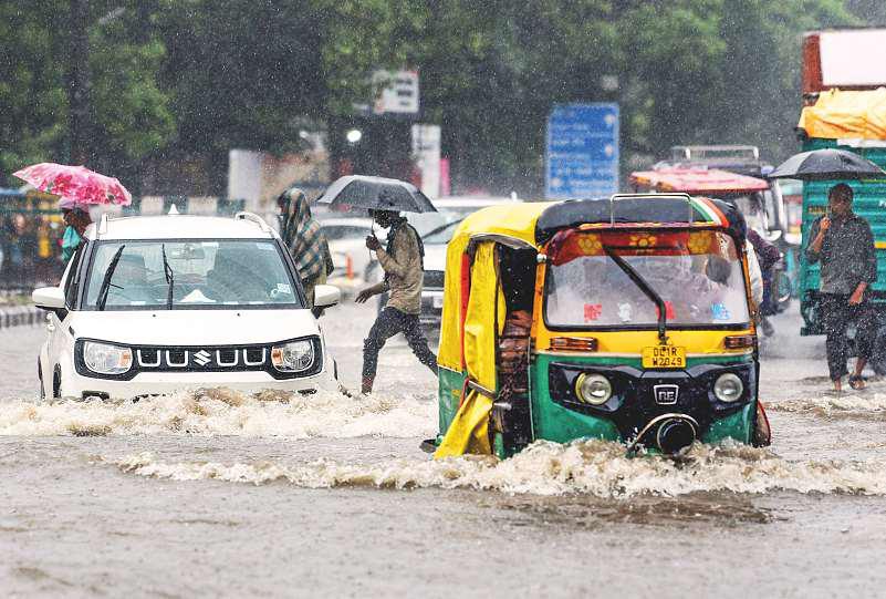Heavy rainfall across Delhi leads to widespread waterlogging, traffic chaos