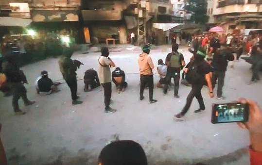 Hamas militants execute 8 in public