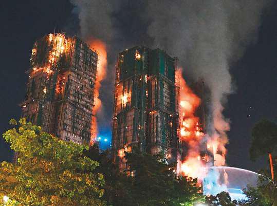 Fire engulfs Hong Kong residential blocks, killing 13