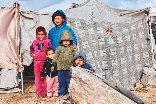 'Shivering from cold and fear': Rains batter Gaza's displaced