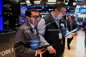 Wall Street rallies and recovers all of Monday's slide as the dollar and US bond market steady