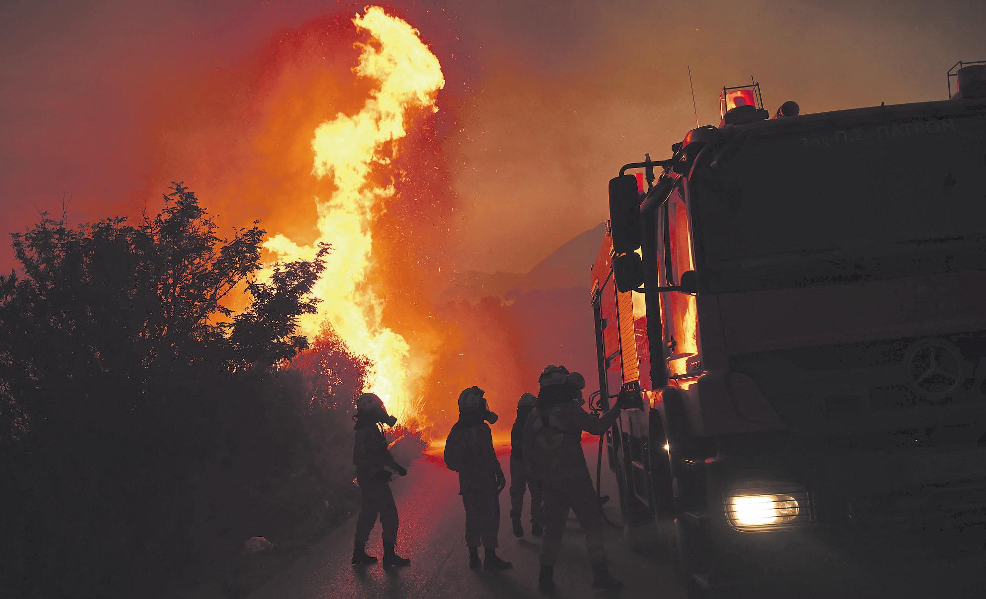 Wildfires kill at least 3, displace thousands in Southern Europe