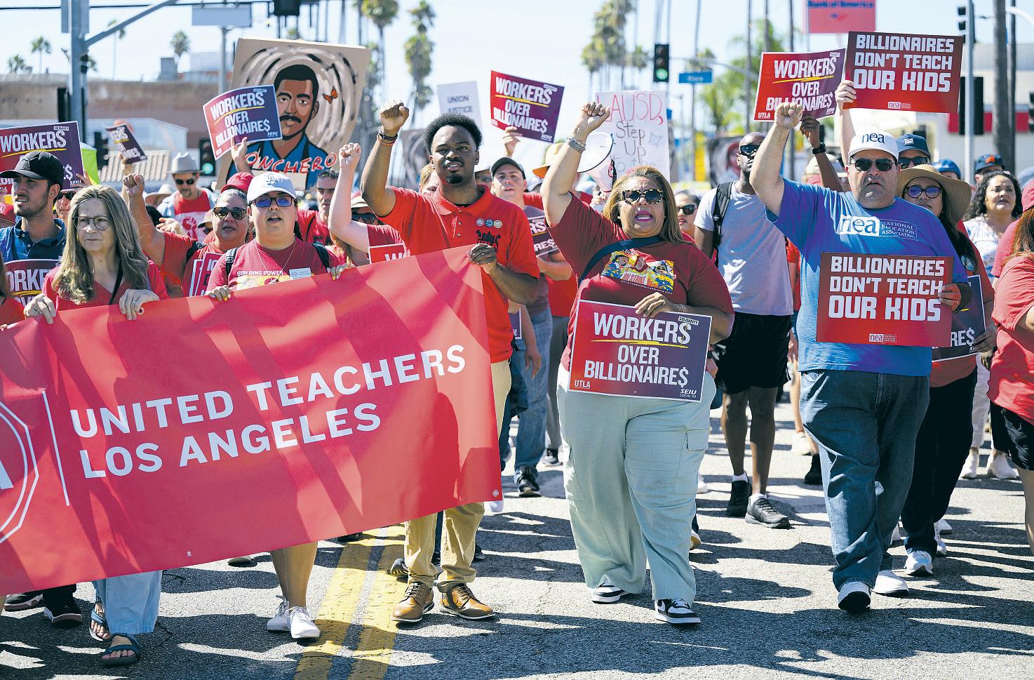Workers unite in decrying Trump at Labor Day rallies and marches
