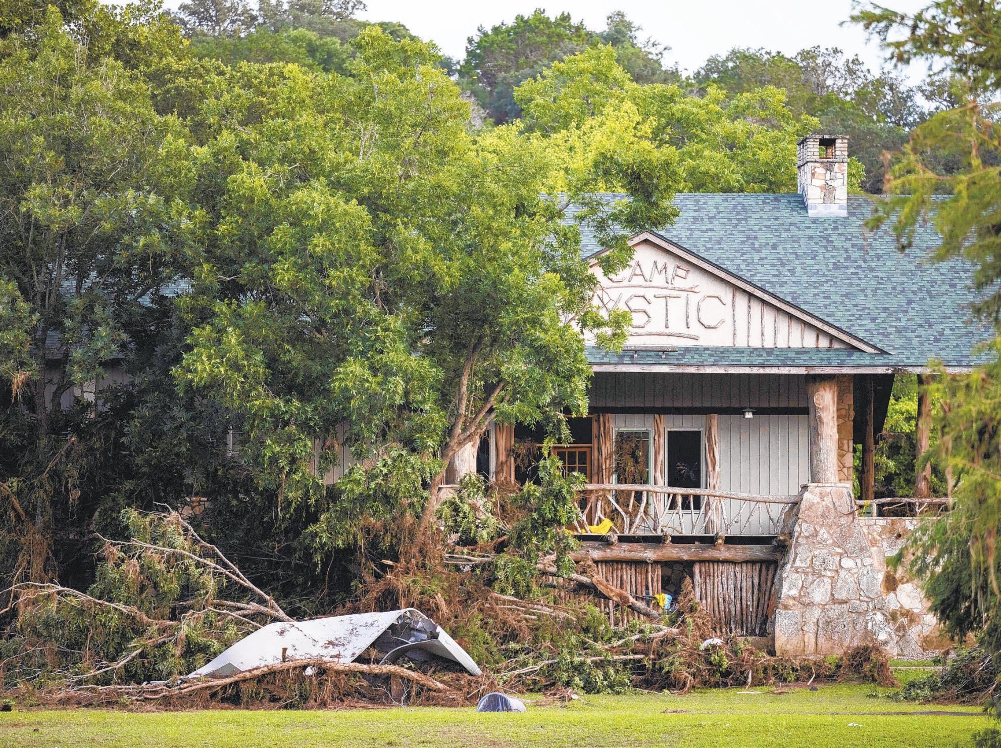 Texas camp where floods killed 27 says it will reopen next year