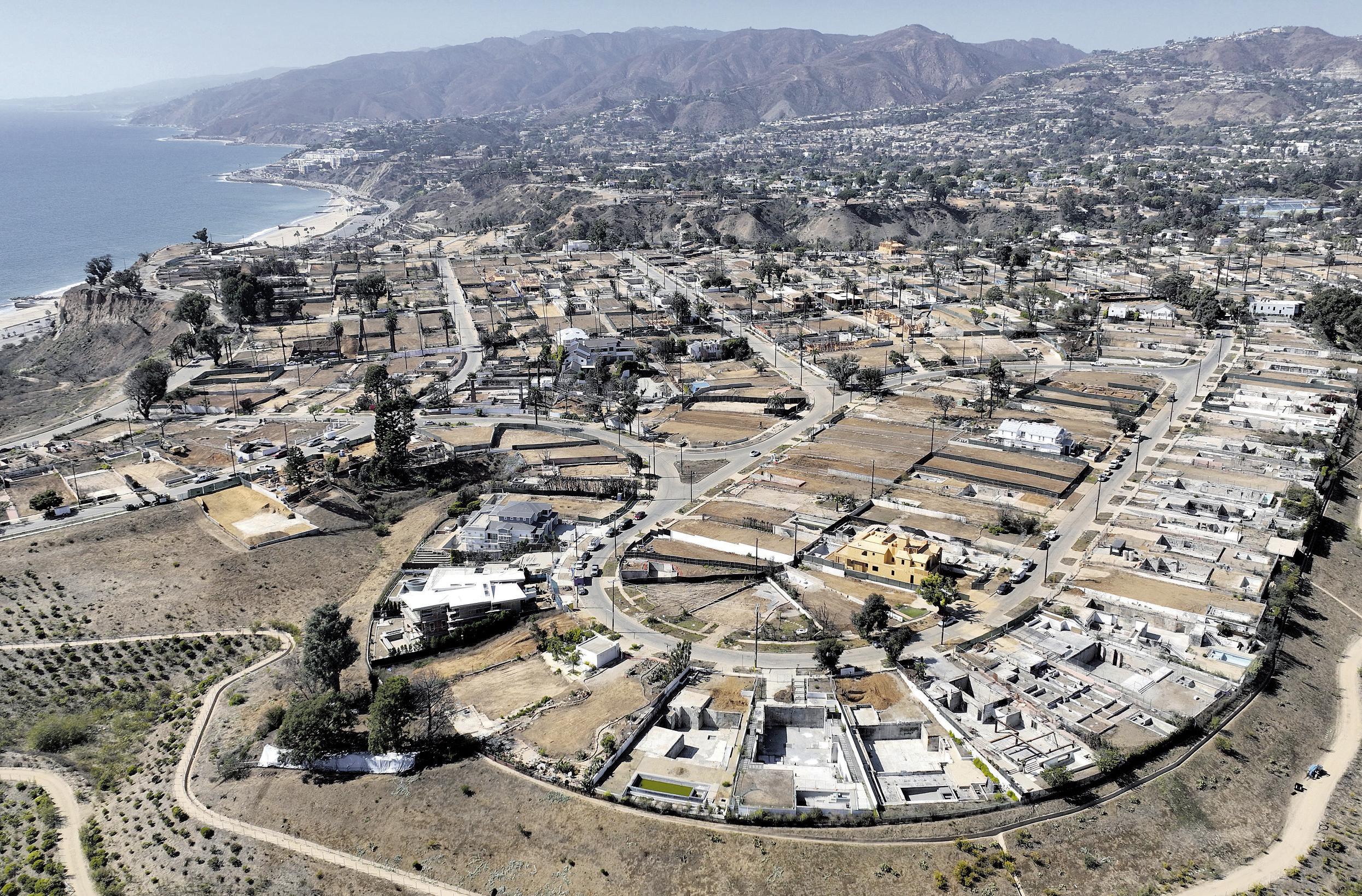 Fire restarted and grew, officials say