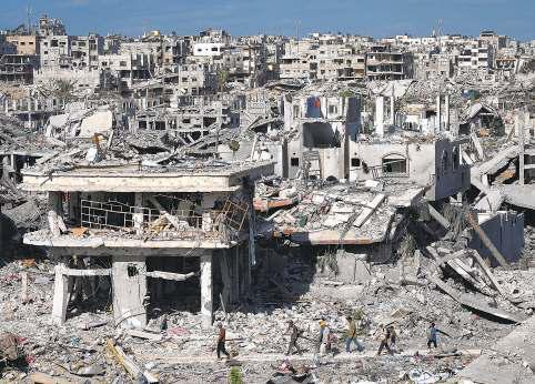 Gazans return to ruins as U.S. troops land in Israel