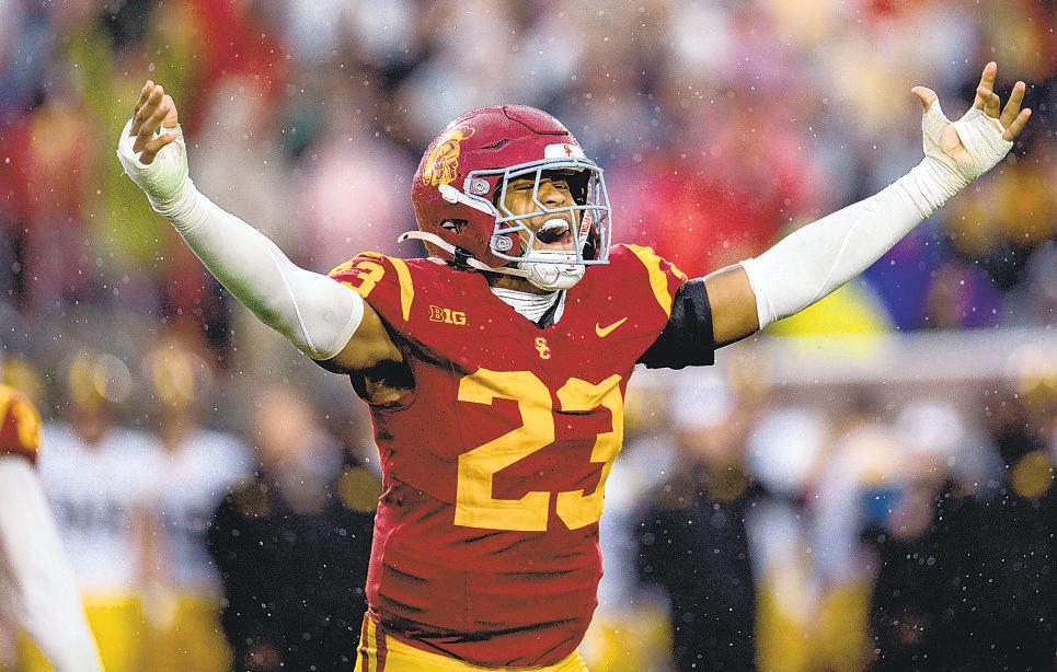 Underwater early, Trojans storm back and soak it to Iowa