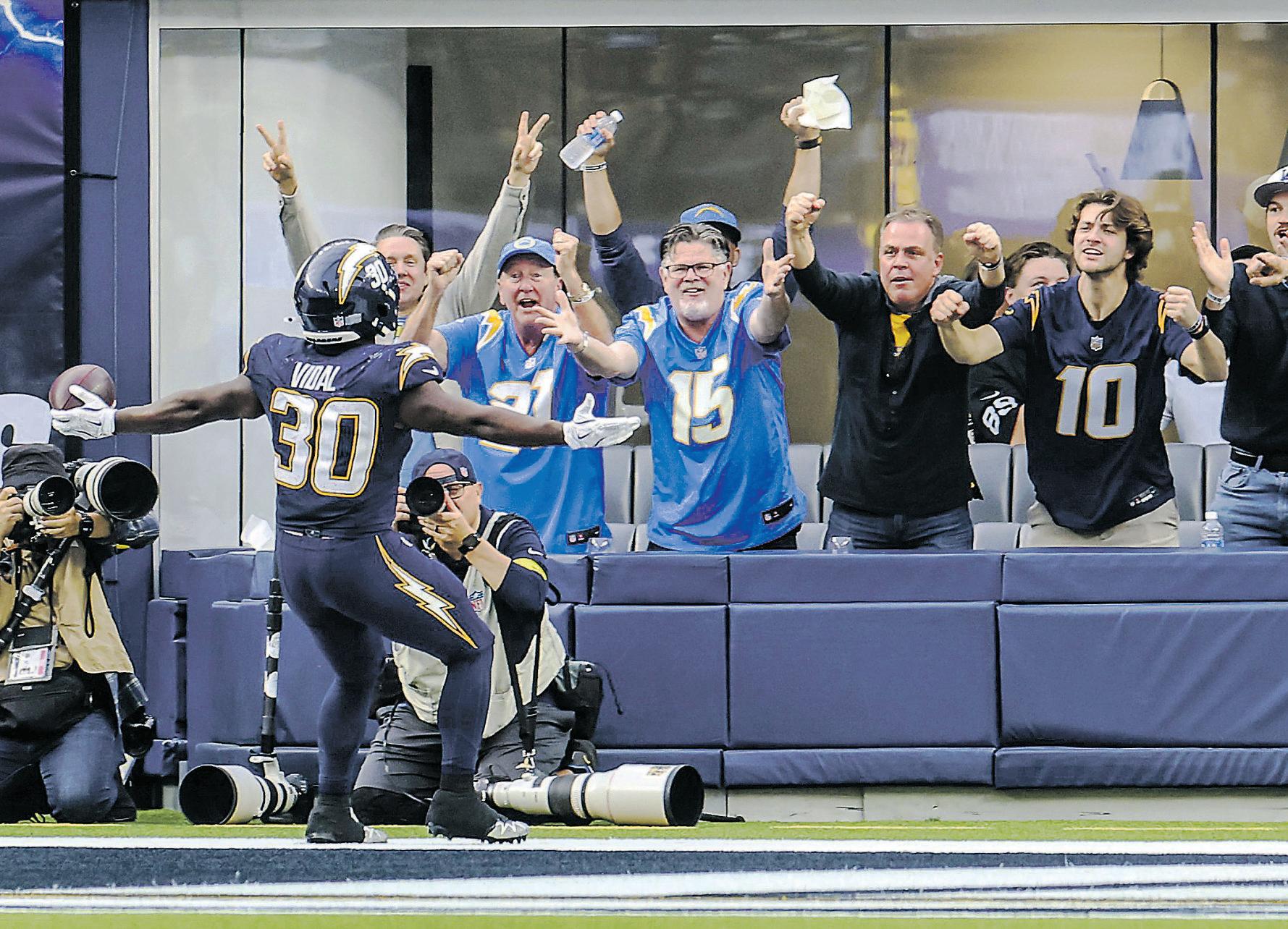 One-handed Herbert sweeps aside Raiders