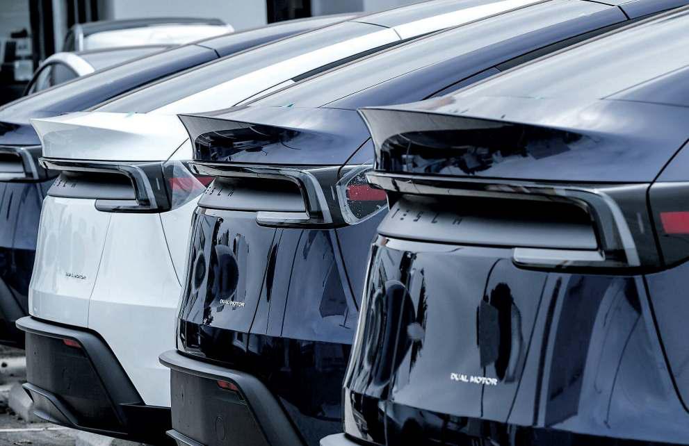 Why Tesla shares rise even as profit outlook sinks