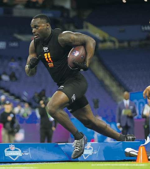 Top two running backs share stage again at combine